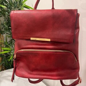 Red faux leather backpack. Great condition. Front zipper pocket.